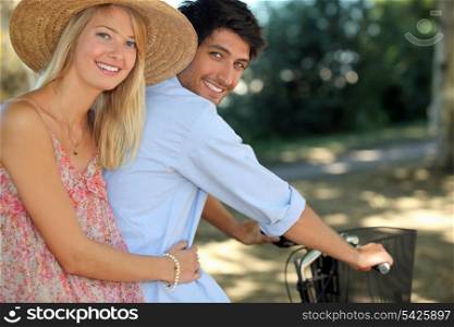 A young couple on a bike ride.