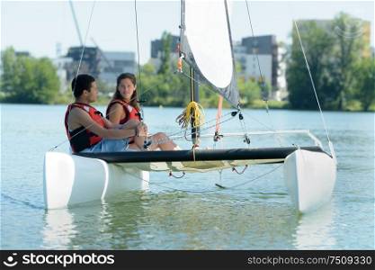 a young couple on catamaran