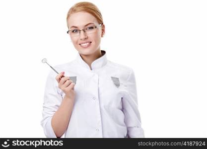 A young dentist with a tool on a white background