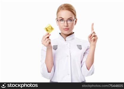 A young doctor with a condom on a white background