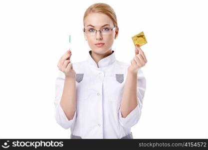 A young doctor with a pregnancy test and with a condom on a white background