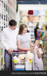 A young family is shopping in a store