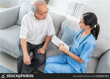 A young female doctor inquires about personal information of a contented senior at home. Medical care for the elderly, elderly illness, and nursing homes, home care.. Young female doctor inquires personal data of a contented senior at home.