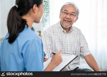 A young female doctor inquires about personal information of a contented senior at home. Medical care for the elderly, elderly illness, and nursing homes, home care.. Young female doctor inquires personal data of a contented senior at home.