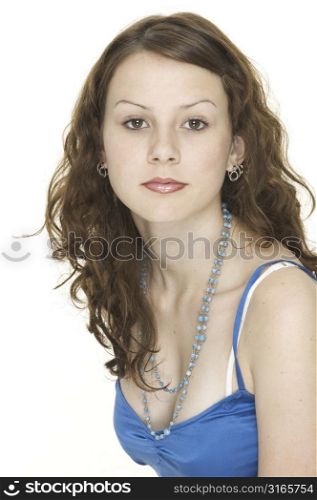 A young female model in a striking blue top