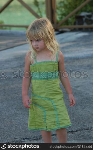 A young girl (6-8) standing outdoors, Moorea, Tahiti, French Polynesia, South Pacific