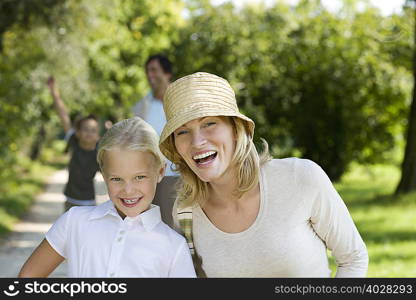 A young girl and her mother in the park