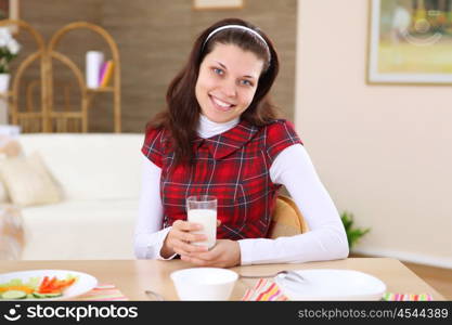 a young girl eating healthy food at home