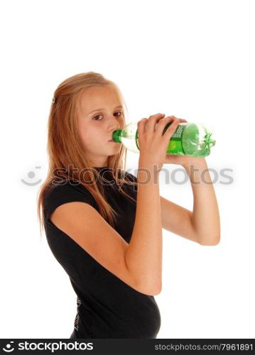 A young girl in a black t-shirt drinking pop out of a green bottle,isolated for white background.