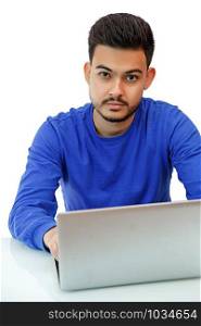 a young guy sitting at a laptop in search of work,doing business on the Internet. on light background