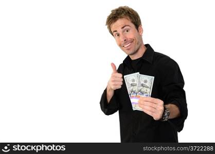 A young handsome man holding a lot of new hundred dollar bills and giving a thumbs up isolated on white background. This newly redesigned US currency was released for circulation in October of 2013.
