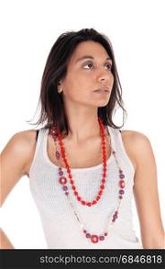 A young Hispanic woman in a white t-shirt and necklace looking up,portrait isolated for white background.. Serious woman looking up.
