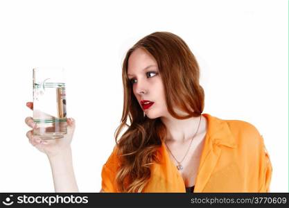 A young lovely woman in a yellow blouse holding a glass of water,isolated for white background.