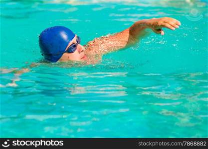 a young male engaged in sports swimming