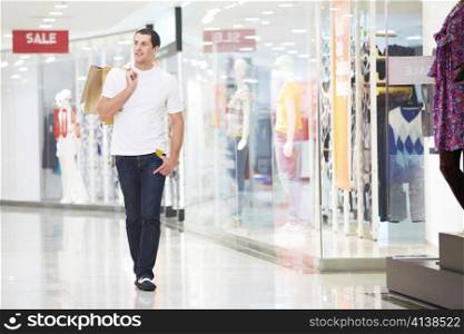 A young man goes shopping with the store