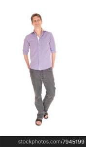 A young man in jeans and a purple shirt standing relaxed isolatedfor white background.