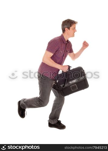 A young man in jeans holding his briefcase and running, isolatedfor white background.