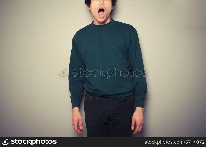 A young man is surprised and has his mouth open