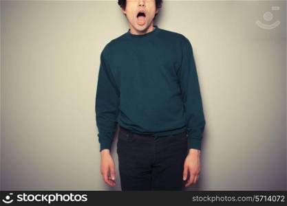 A young man is surprised and has his mouth open