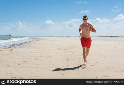 a young man running along the coast