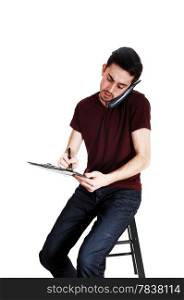 A young man with a phone on his ear and writing on his clipboard,isolated for white background.