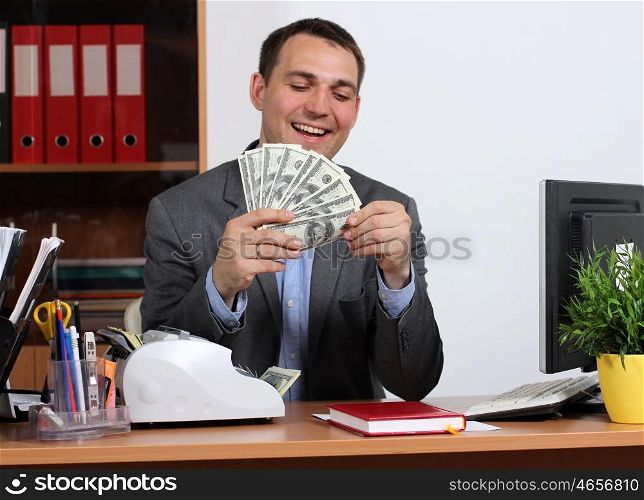 A young man with dollars in their hands
