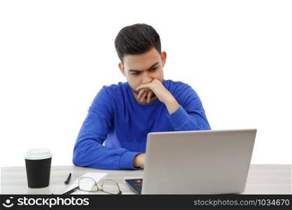 a young man working on a laptop. he&rsquo;s angry and tired . on white isolated background