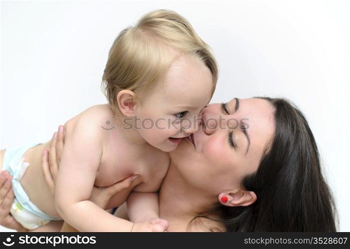 a young mother kissing her little baby
