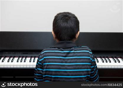 a young passionate musician playing the piano