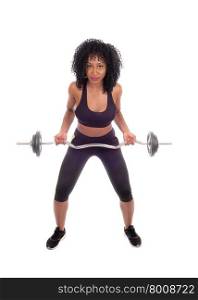 A young pretty African American woman in exercising outfit lifting weight,with black curly hair, isolated for white background.