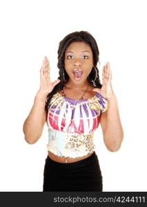 A young pretty black woman standing for white background with her handsup, is very surprised what she has seen.