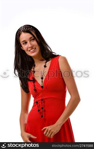 A young pretty brunette wearing a red summer dress is looking off to her left and smiling.