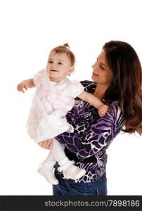 A young pretty mother holding her baby girl in her arms, isolated forwhite background.