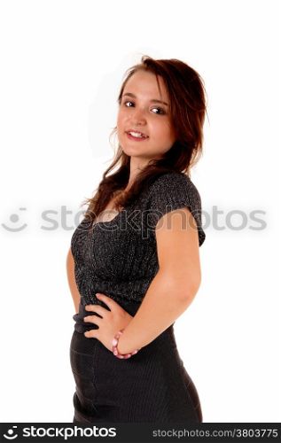 A young pretty teenager girl standing in profile isolated for whitebackground.