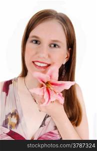 A young pretty woman in a portrait picture holding a pink lily in her hand,smiling, isolated for white background.
