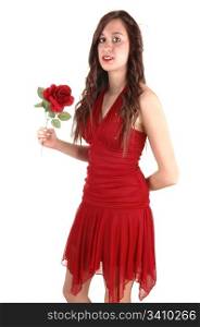 A young pretty woman in a red dress and with a red rose in her handstanding in the studio, smiling, for white background.