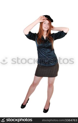 A young pretty woman with long red hair in a green blouse wearinga hat with buttons on, for white background.