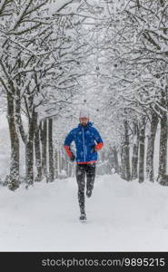 A young runner in a floor lined with snow