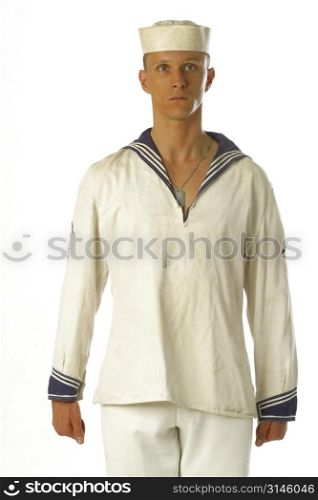 A young sailor man poses in the studio.