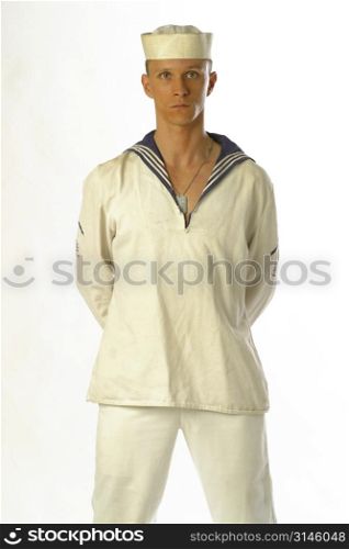 A young sailor man poses in the studio.