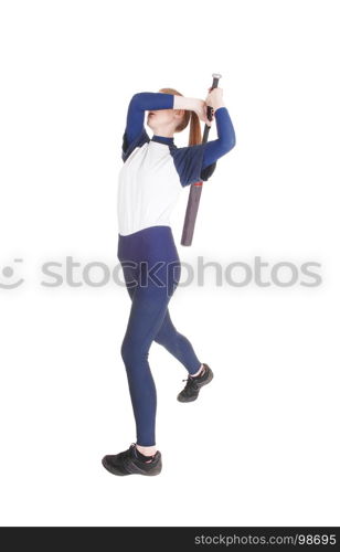 A young slim woman playing softball, swinging her bad to hit the ballin a blue uniform, isolated for white background