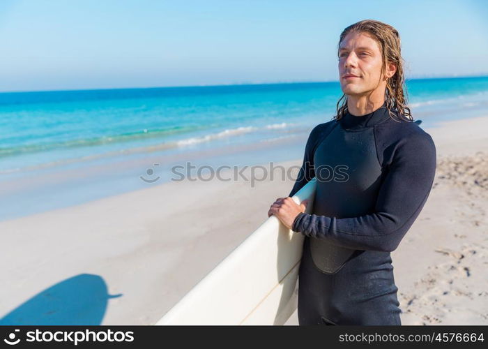 A young surfer with his board on the beach. Ocean is my life