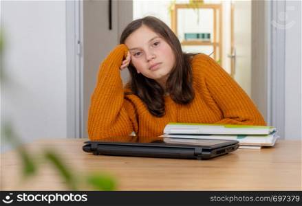 a young teenage girl with an yellow sweater