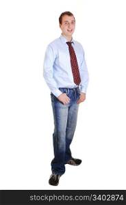 A young teenager in jeans and blue dress shirt with tie standing in thestudio for white background isolated.