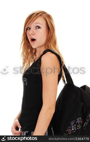 A young teenager with her back bag overher shoulder on the way to school, on white background.