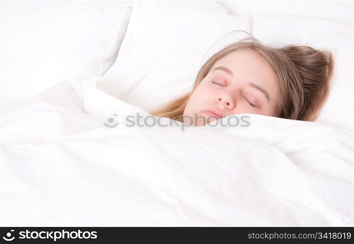 a young woman asleep in her bed