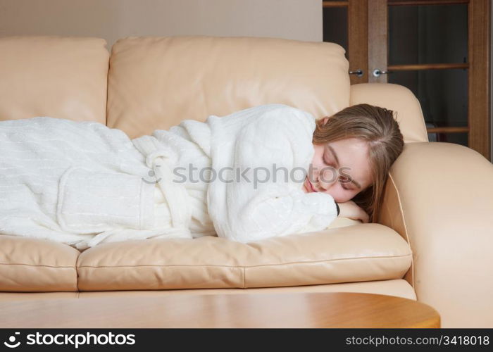 a young woman asleep on the sofa