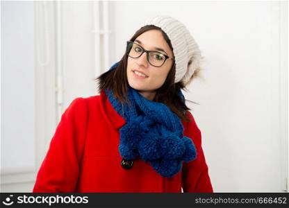a young woman brunette woman with a coat and a winter cap