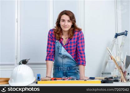 a young woman doing DIY work at home