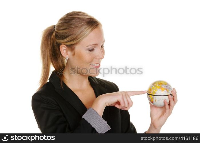 a young woman holding a globe in his hand. symbolic photo for travel and tourism environment
